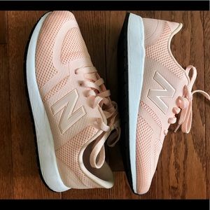 Peach New Balance tennis shoes